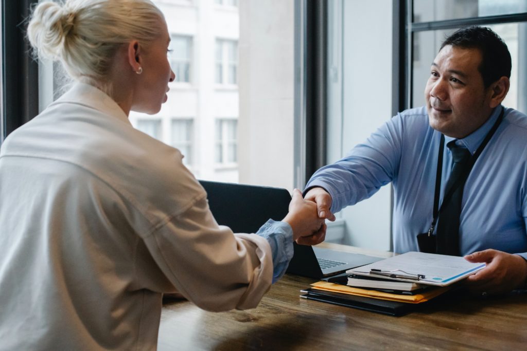 man and woman in IT job interview